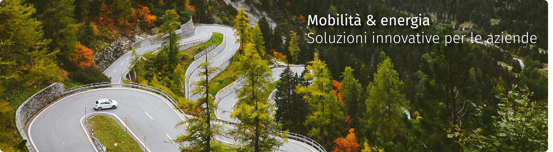Mobilità & energia - Soluzioni innovative per le aziende. Macchina su strada di montagna. Foto di Johannes Hofmann su Unsplash.